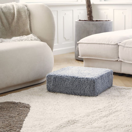 Kort, krøllete saueskinnspuff i ull Koksgrå