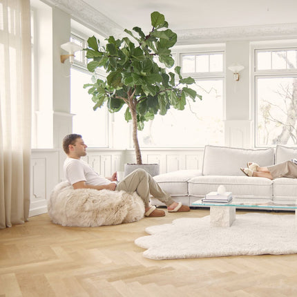 Rund saueskinnspose i lang ull | Medium | Stor Svart